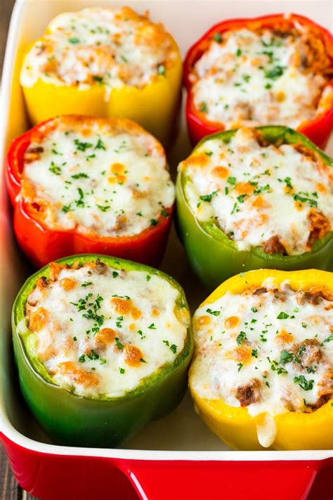Photo of stuffed bell peppers in a pot with tomato sauce