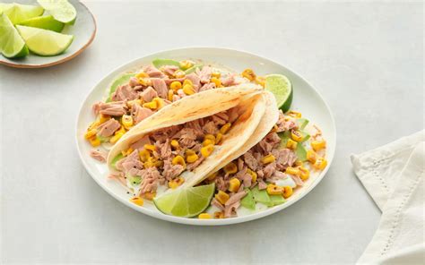 Serving suggestion of tuna and corn with rice in tomato sauce