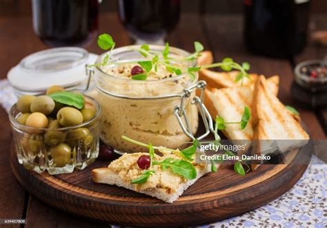Photo of a chicken pate with olives and herbs