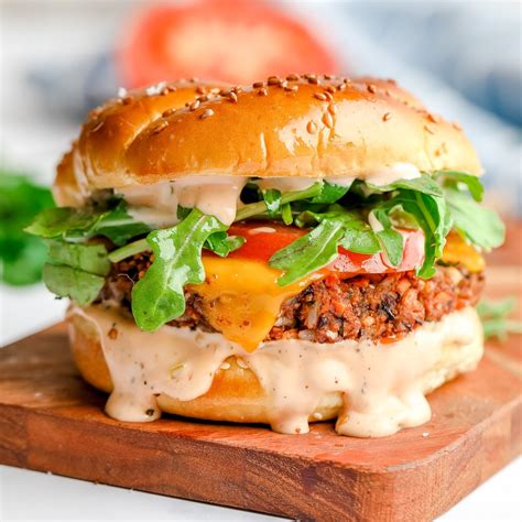 Thematic photo of a delicious looking vegetarian burger with many toppings