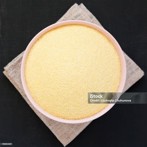 The texture of dry semolina grains in a bowl