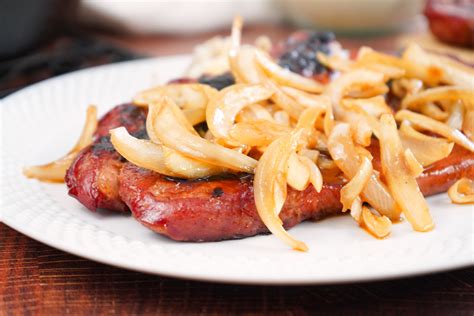 Thematic photo of cooked pork steak with onions in the oven