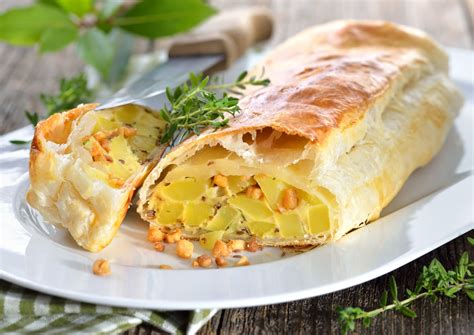 Thematic photo of potato strudel slices with various sauces or toppings