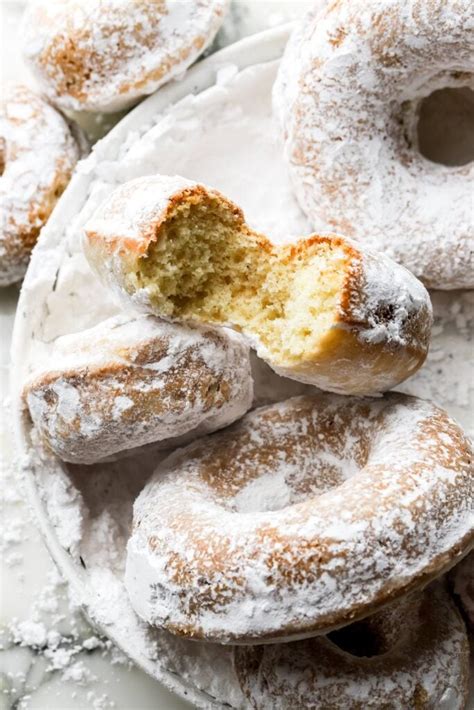 Thematic photo of fluffy egg-free donuts with powdered sugar