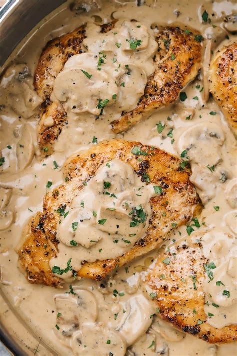 Thematic photo of chicken in mushroom sauce with parsley in a pan, ready to serve