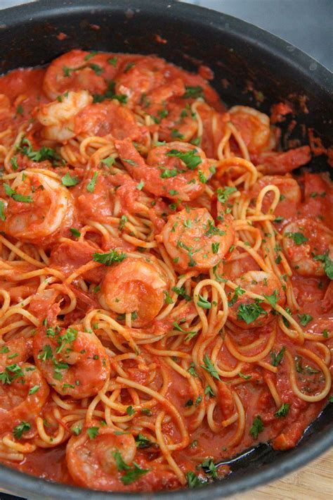 Thematic photo of spaghetti with shrimp and tomatoes
