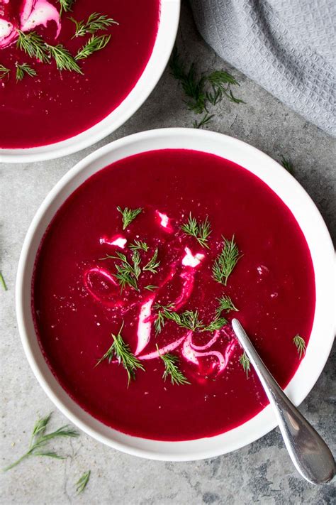 Ingredients for preparing red beet soup laid out on a kitchen counter.