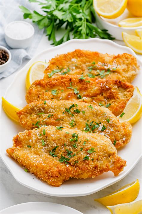 Photo of breaded chicken cutlets on a baking sheet
