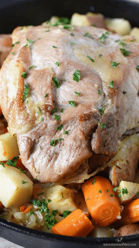 Thematic photo of a pork roast in a baking dish with vegetables and water, ready for the oven
