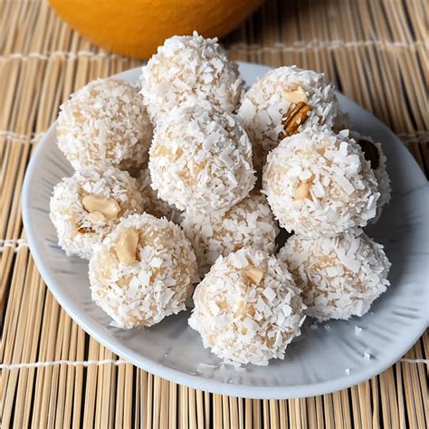 Thematic photo of snowballs with nuts and orange