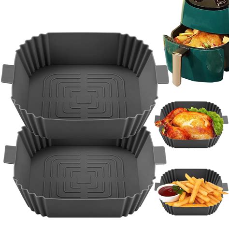 Photo of various air fryer accessories, such as silicone molds and perforated baking paper