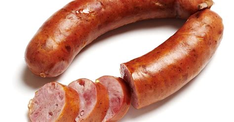 The Kranjska klobasa in a pair, tied with a wooden skewer, with a smoky aroma
