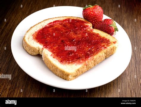 Thematic photo of homemade strawberry jam on toast