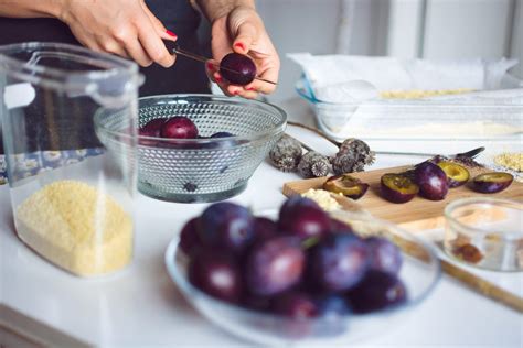 Step-by-step photo collage of preparing plums for baking
