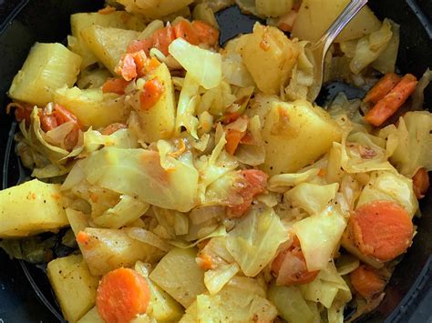 Thematic photo of a traditional dish: stewed cabbage with potatoes