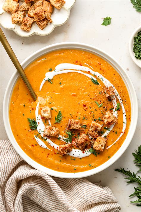 Photo of a lentil soup with ginger, curry, and a swirl of cream