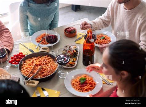 Photo of a homemade pasta dish served among friends