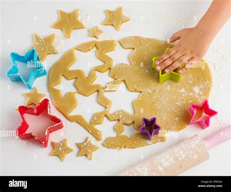 Diagram or photo of rolling cookie dough and cutting shapes