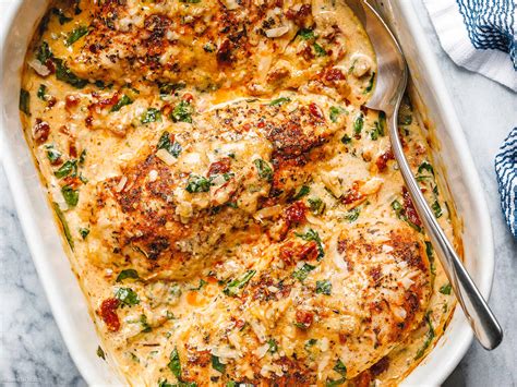 Photo of baked chicken in a creamy sauce in a baking dish