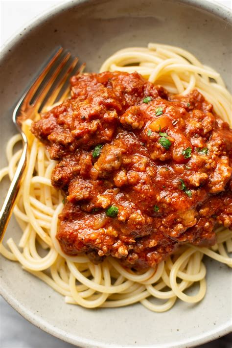 Ground chicken meat sauce with carrots and tomato, served with pasta