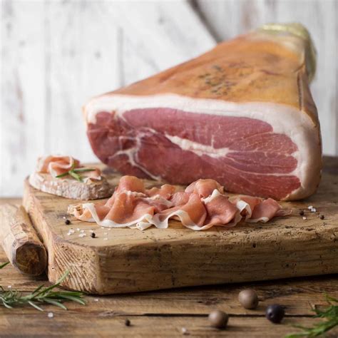Thematic photo of a pork leg being prepared for prosciutto