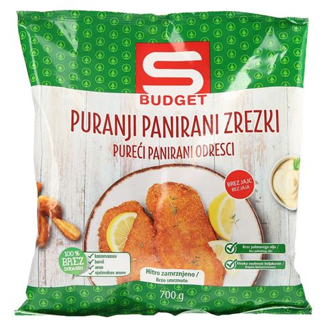 Panirani piščančji zrezki, pečeni do zlato-rumene barve.