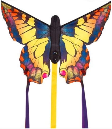 primer otroške torte v obliki metulja z modrimi in zlatimi detajli