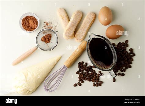 Photo of high-quality ingredients for tiramisu: Savoiardi biscuits, mascarpone, coffee beans, cocoa powder