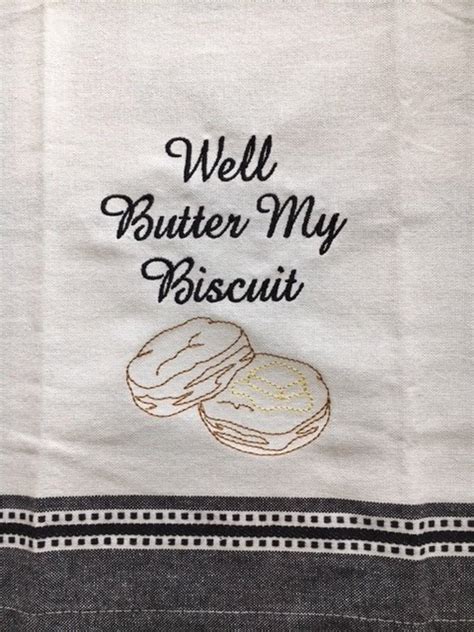 Photo of a biscuit being rolled with a kitchen towel