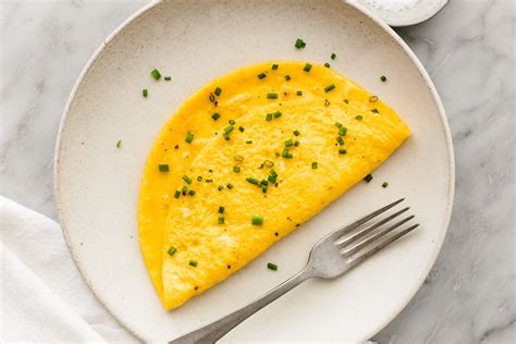 Thematic photo of a thin, golden-yellow omelette