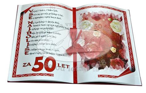 Fotografija torte v obliki odprte knjige z napisom 50