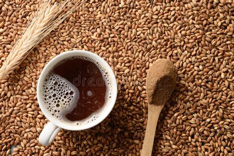 Thematic photo of a cup of traditional barley coffee with a slice of dark bread