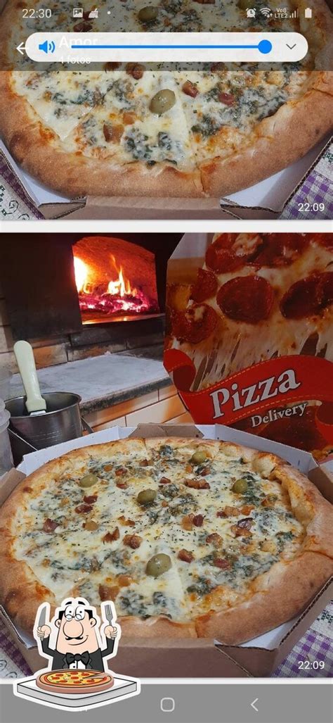 Notranjost pizzerije Dal Forno, ki prikazuje prijeten ambient in urejene mize.