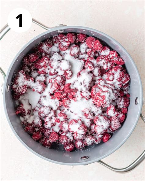 Photo of fresh raspberries cooking in a pot for the topping