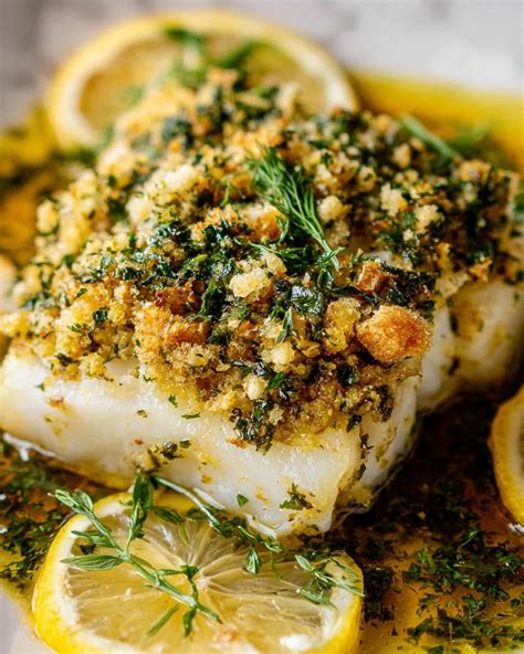 Baked fish fillet with a golden crust and herbs