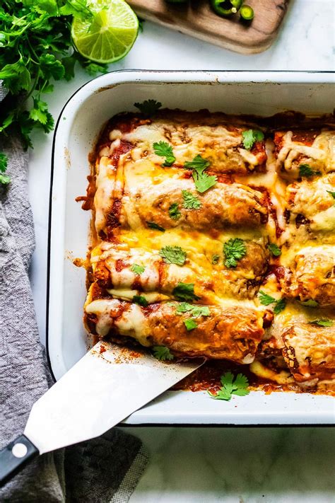 Baked chicken enchiladas in a baking dish.