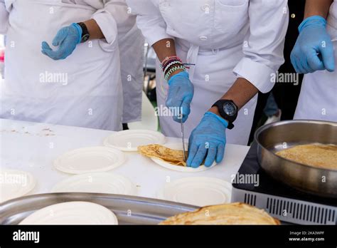 Contestants focused on preparing crepes for the cake