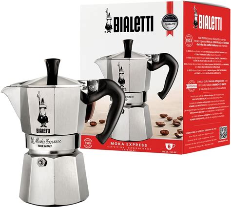 The iconic Bialetti Moka Express stovetop coffeemaker, perhaps with steam rising, on a kitchen counter.