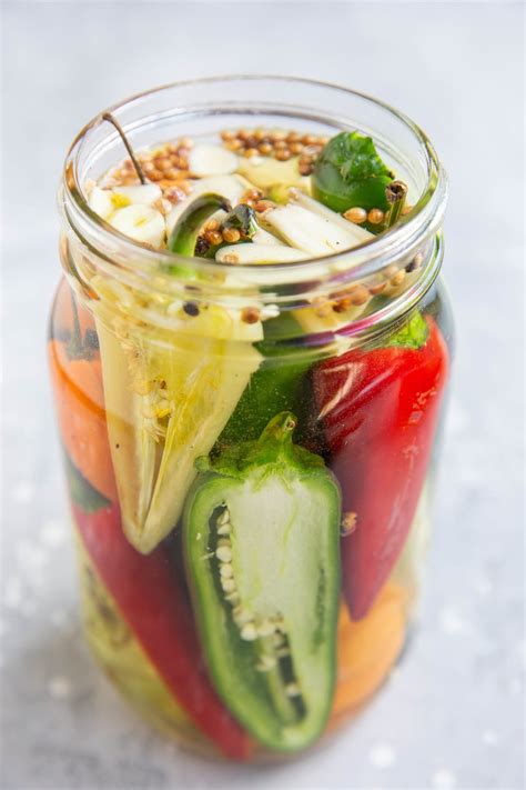 Photo of crispy pickled peppers in a jar