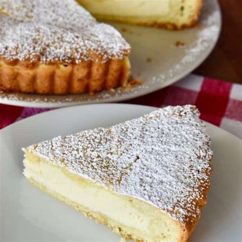 Photo of a bowl with ricotta cheese, sugar, and eggs for a pie filling