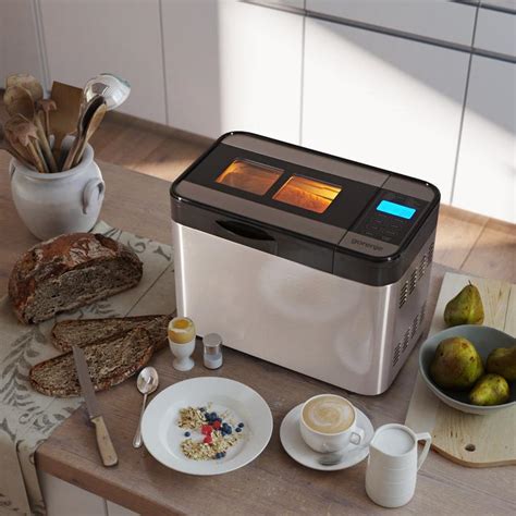 The Gorenje BM900W bread maker on a kitchen counter, with safety instructions highlighted.