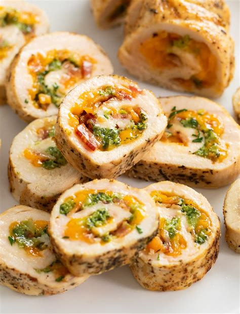 Cross-section of chicken roulade with colorful vegetable filling, baked in foil
