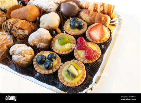 An assortment of delicious celebration cakes and pastries, cut into neat slices