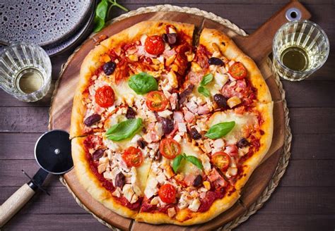 Thematic photo of a delicious pizza served on a wooden board