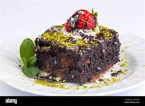 Thematic photo of a delicious looking Turkish wet cake (Islak Kek) with chocolate sauce