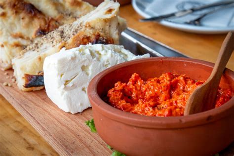Photo of ajvar being served with various dishes