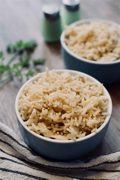 Thematic photo of a cooked brown basmati rice dish with asparagus and peas