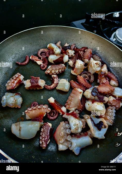 Image of pre-cooked octopus being prepared for baking