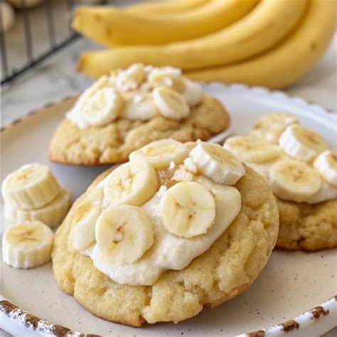 A plate of freshly baked banana pudding cookies, lightly golden brown.