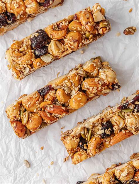 Photo of raw snack bars with visible nuts and dried fruits.